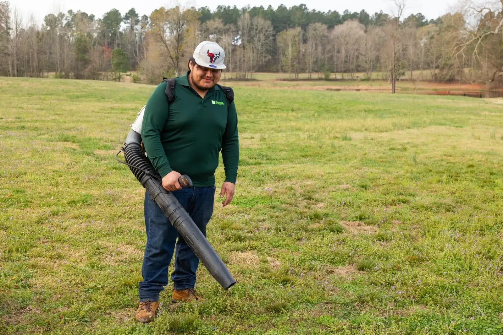 Crew member using professional leaf blower