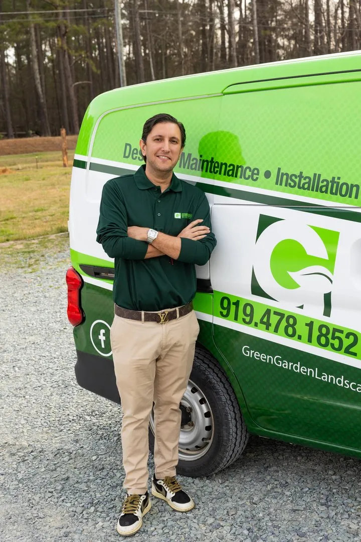 Owner with branded Green Garden service van