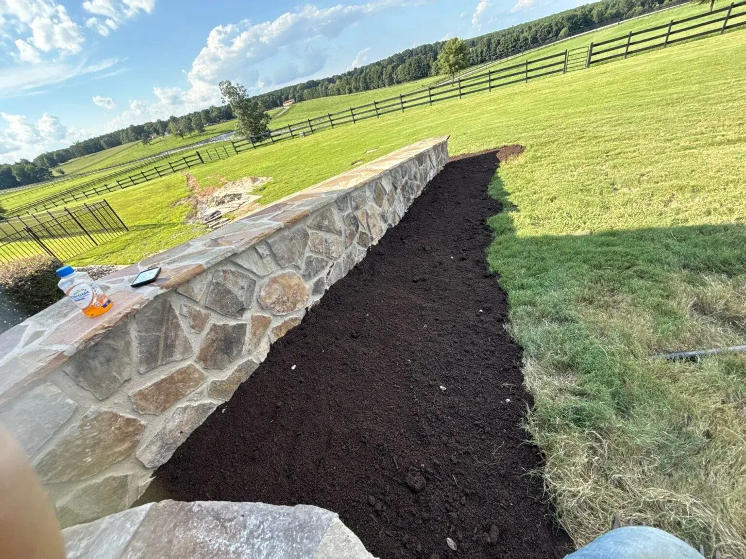 Brick house with fresh mulch beds and professional landscape design in Sanford NC