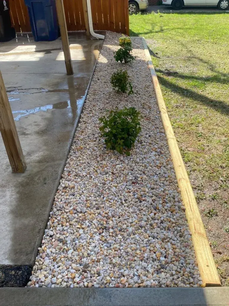 Custom brick planter box with fresh plantings