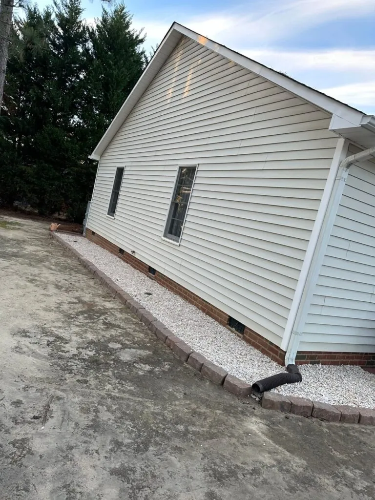 Commercial property entry landscaping with professional plantings