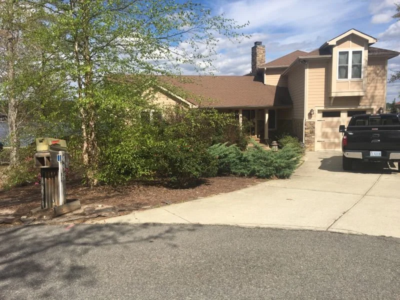 Fresh dark mulch beds with clean edging
