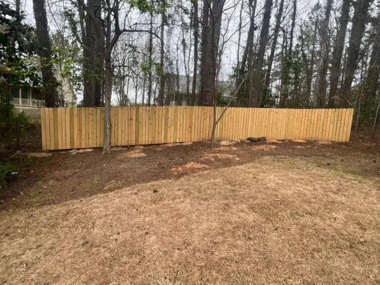 Bare dirt yard with no grass before sod installation
