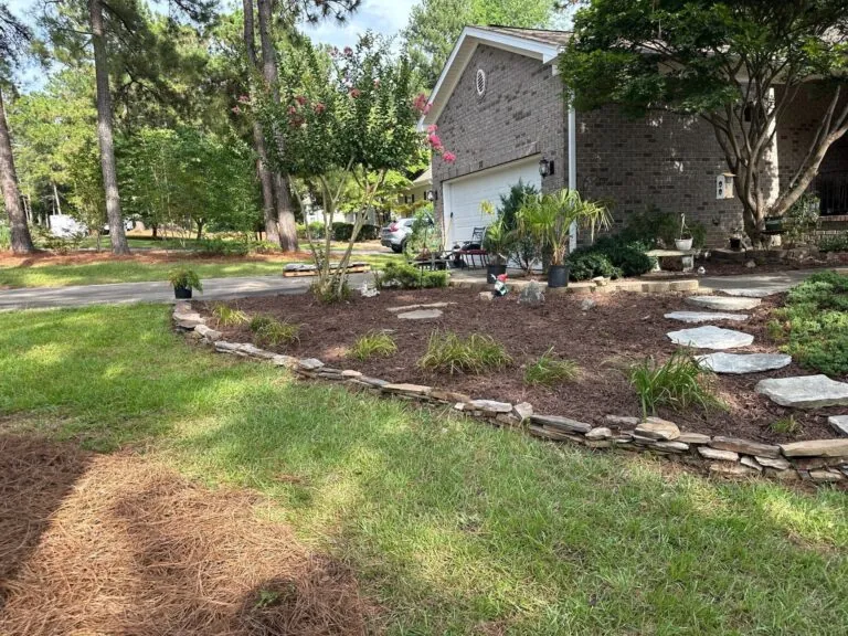 Stone walkway through professionally landscaped yard in central NC